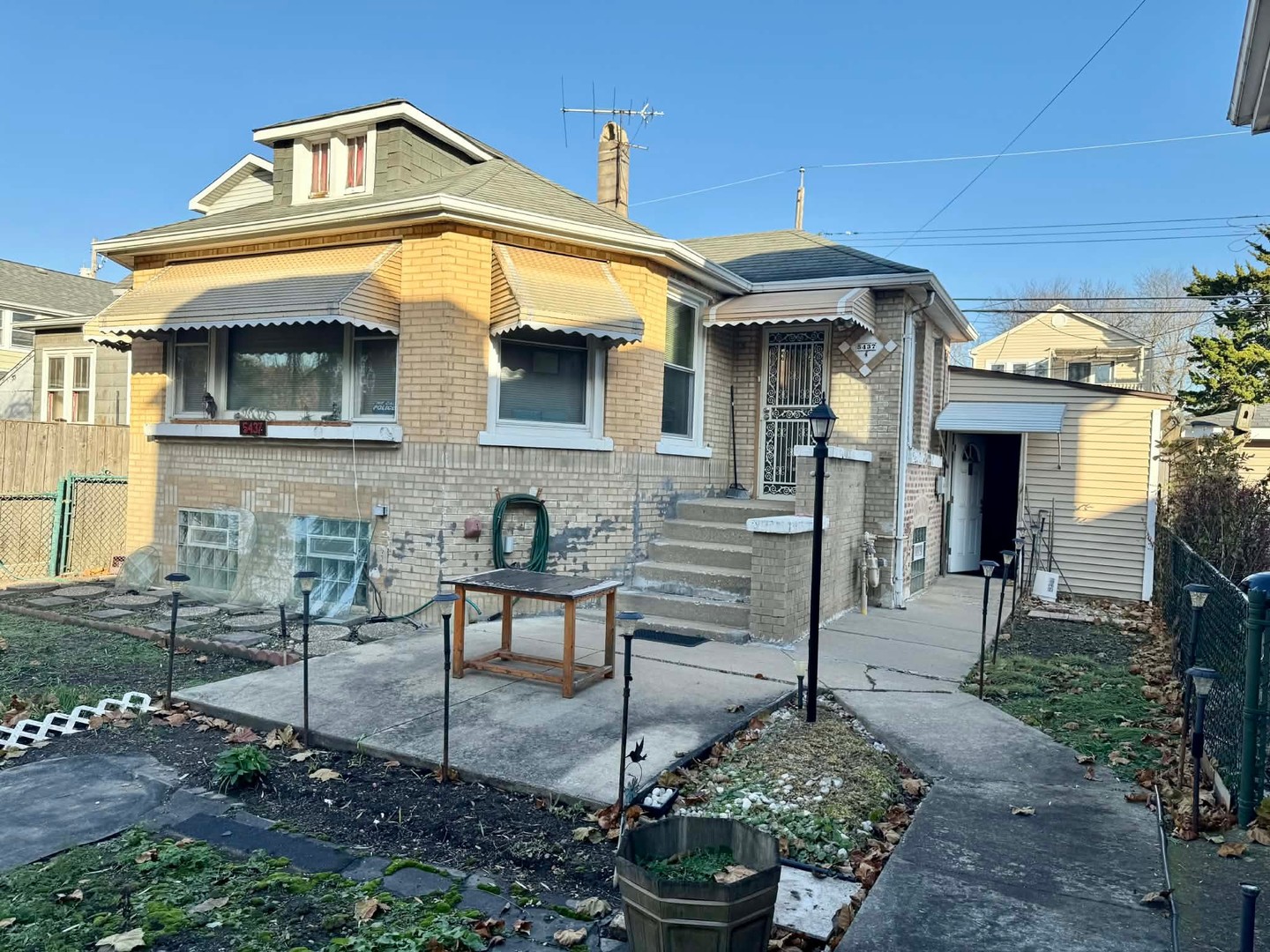 5437 North Linder Avenue Chicago, IL 60630 - Photo 26 of 28 a front view of a house with garden