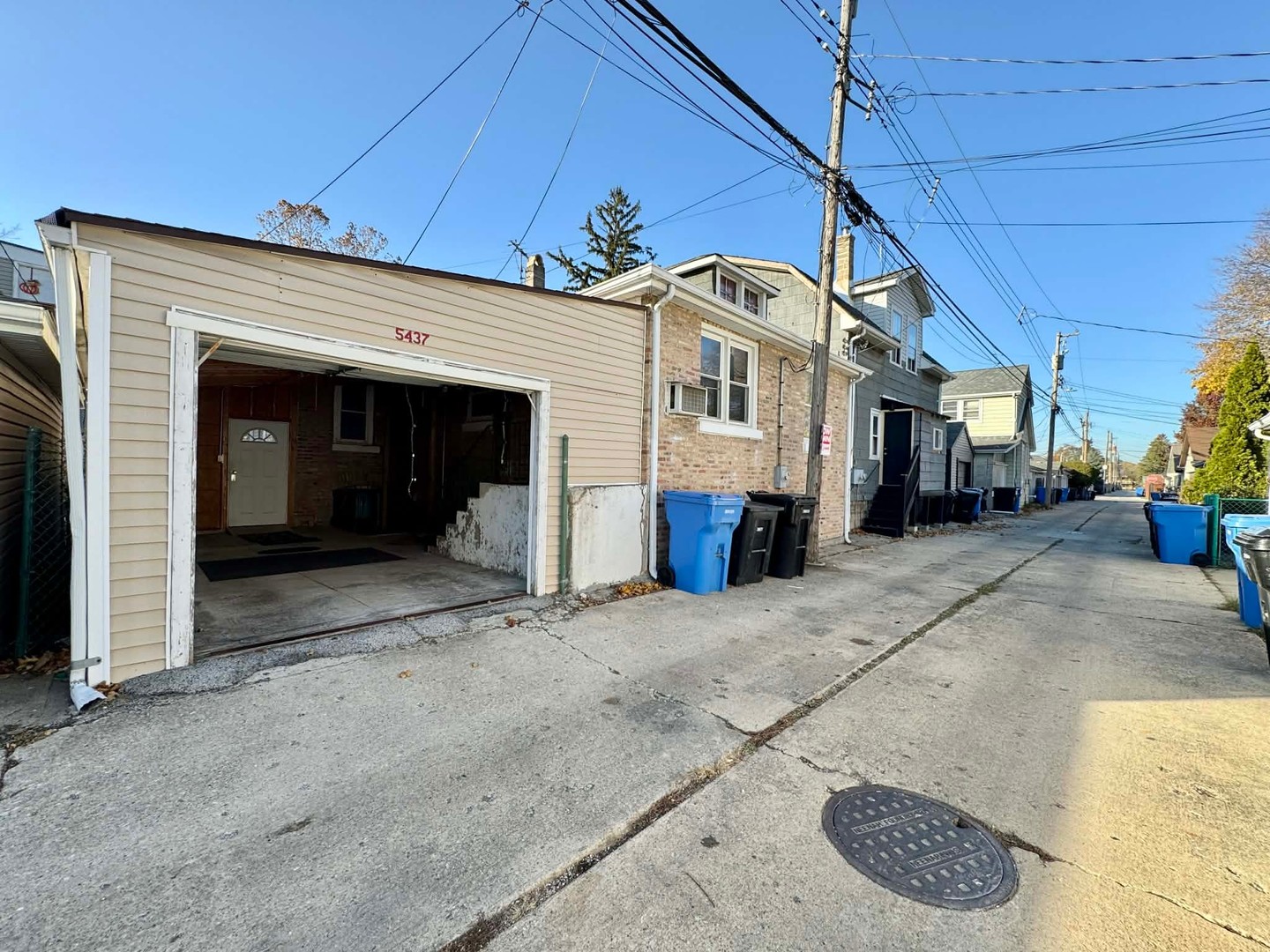 5437 North Linder Avenue Chicago, IL 60630 - Photo 27 of 28 a view of a white house with a sink and a yard