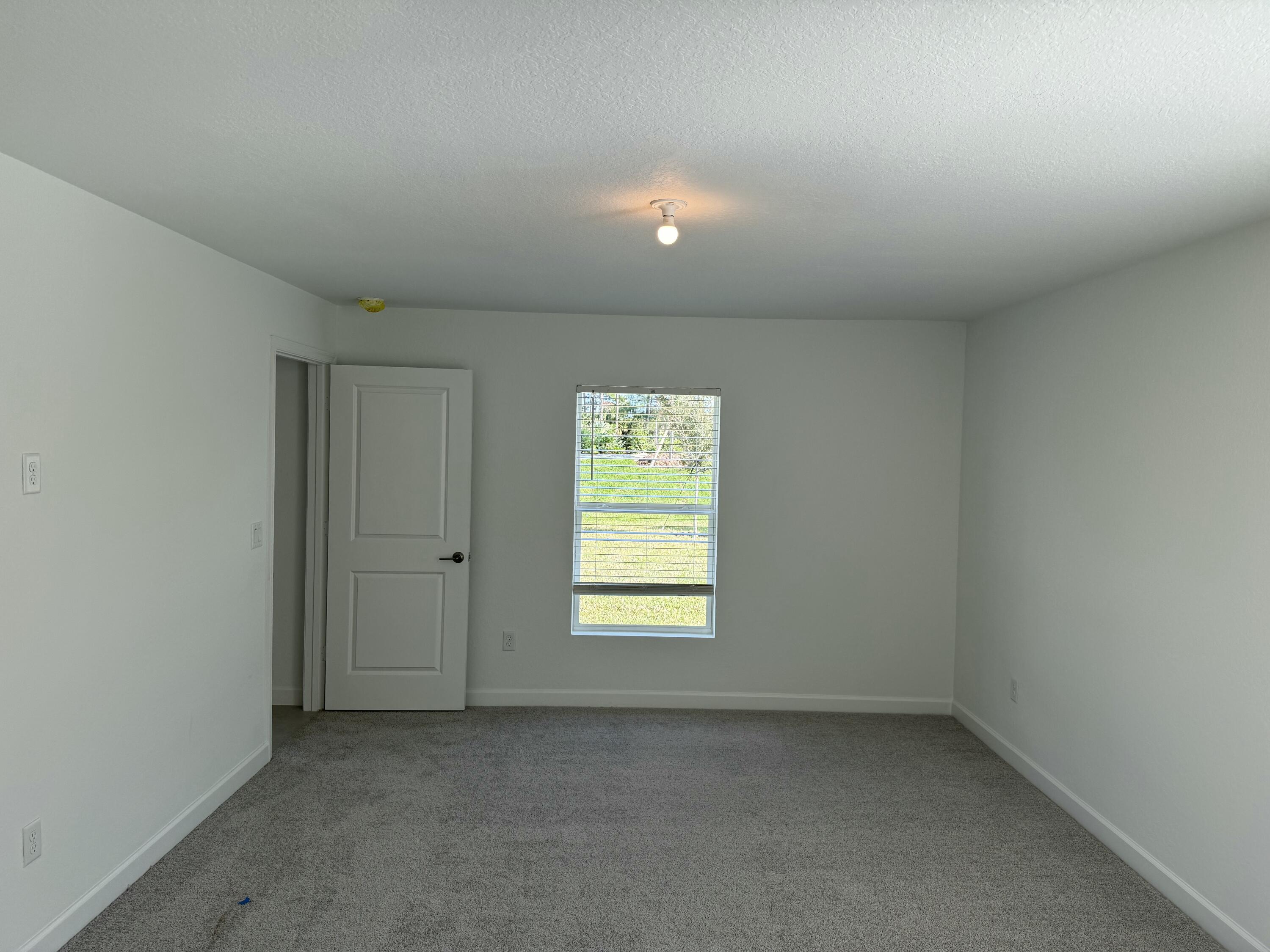 10445 Northwest Suncrest Loop Port Port St. Lucie, FL 34987 - Photo 30 of 45 an empty room with window