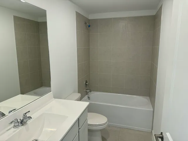 a bathroom with a bathtub and sink