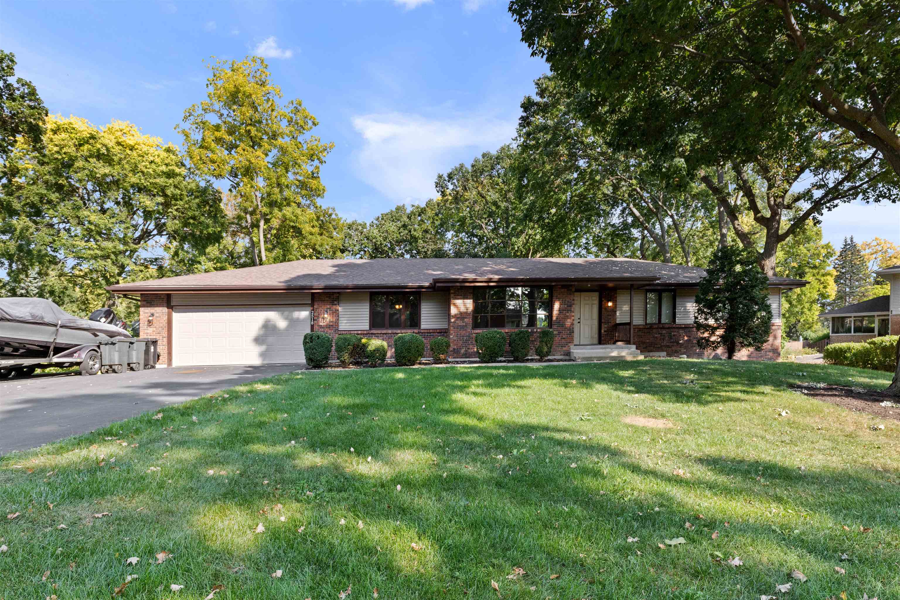 2518 Mandrake Drive Rockford, IL 61108 - Photo 1 of 50 a front view of a house with a garden