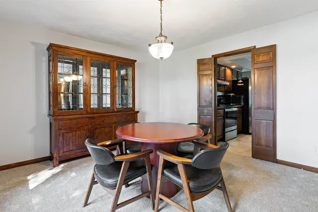 a dining room with furniture and window