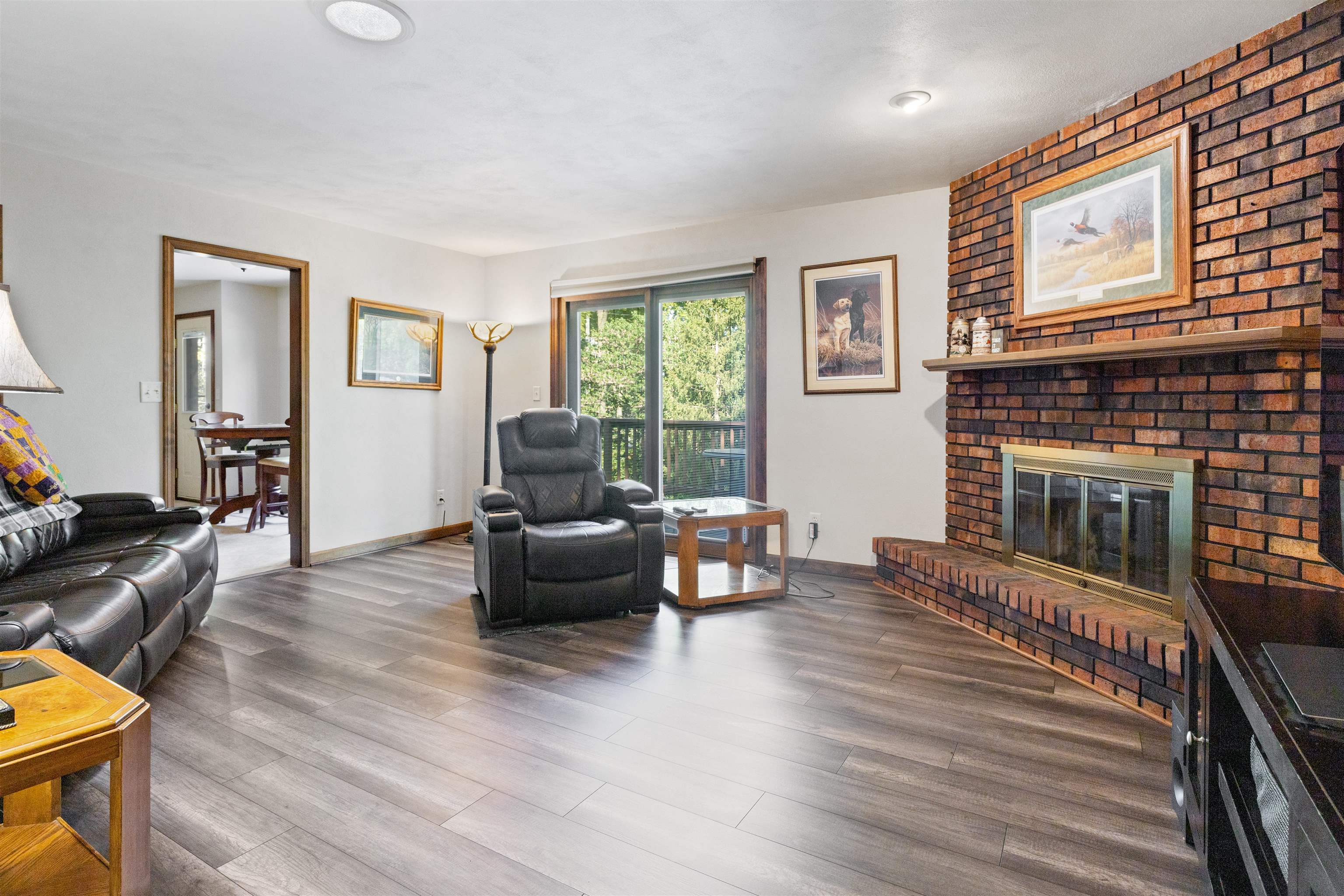 2518 Mandrake Drive Rockford, IL 61108 - Photo 17 of 50 a living room with furniture and a fireplace