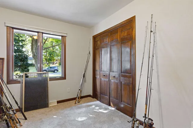 a view of an empty room with windows