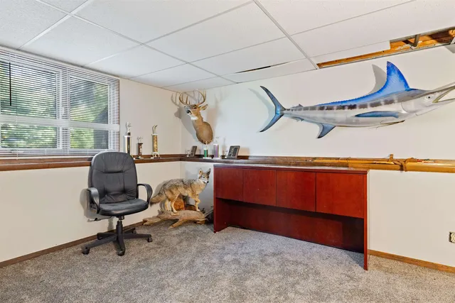 a room with gym equipment and a large window