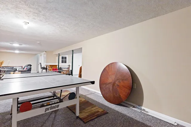 a view of kitchen with kitchen island a stove and wooden floor