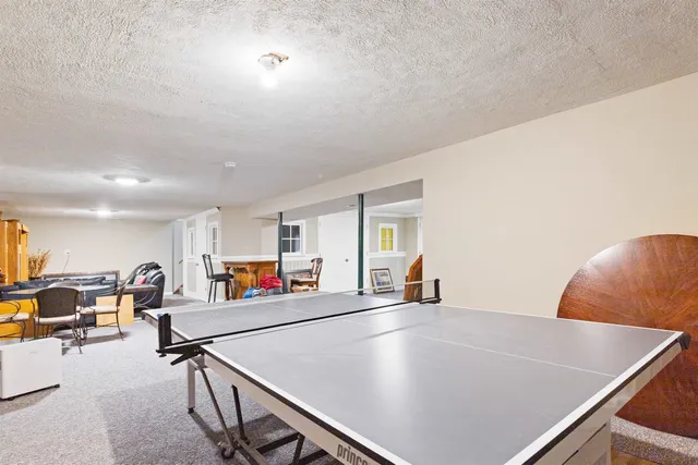 a room with lots of table and chairs