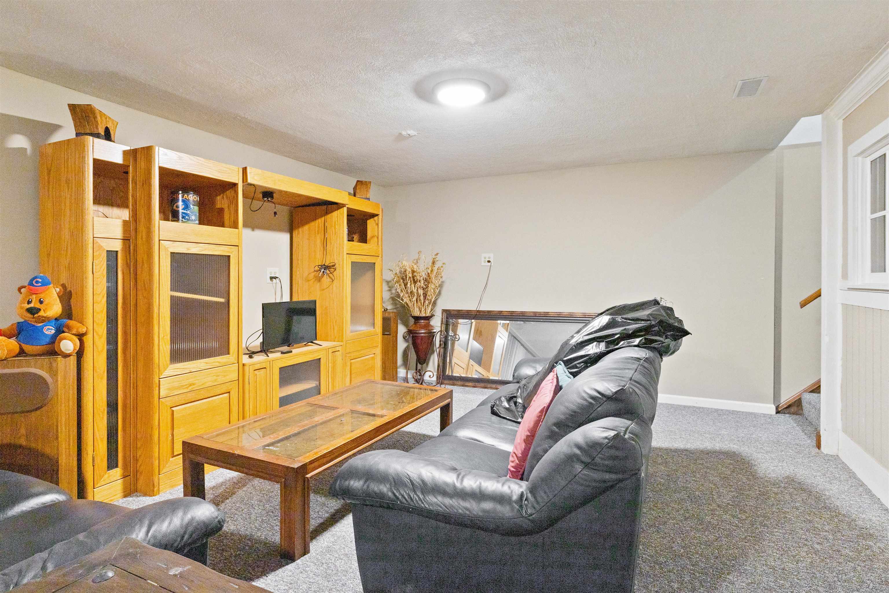 2518 Mandrake Drive Rockford, IL 61108 - Photo 36 of 50 a living room with furniture and a window