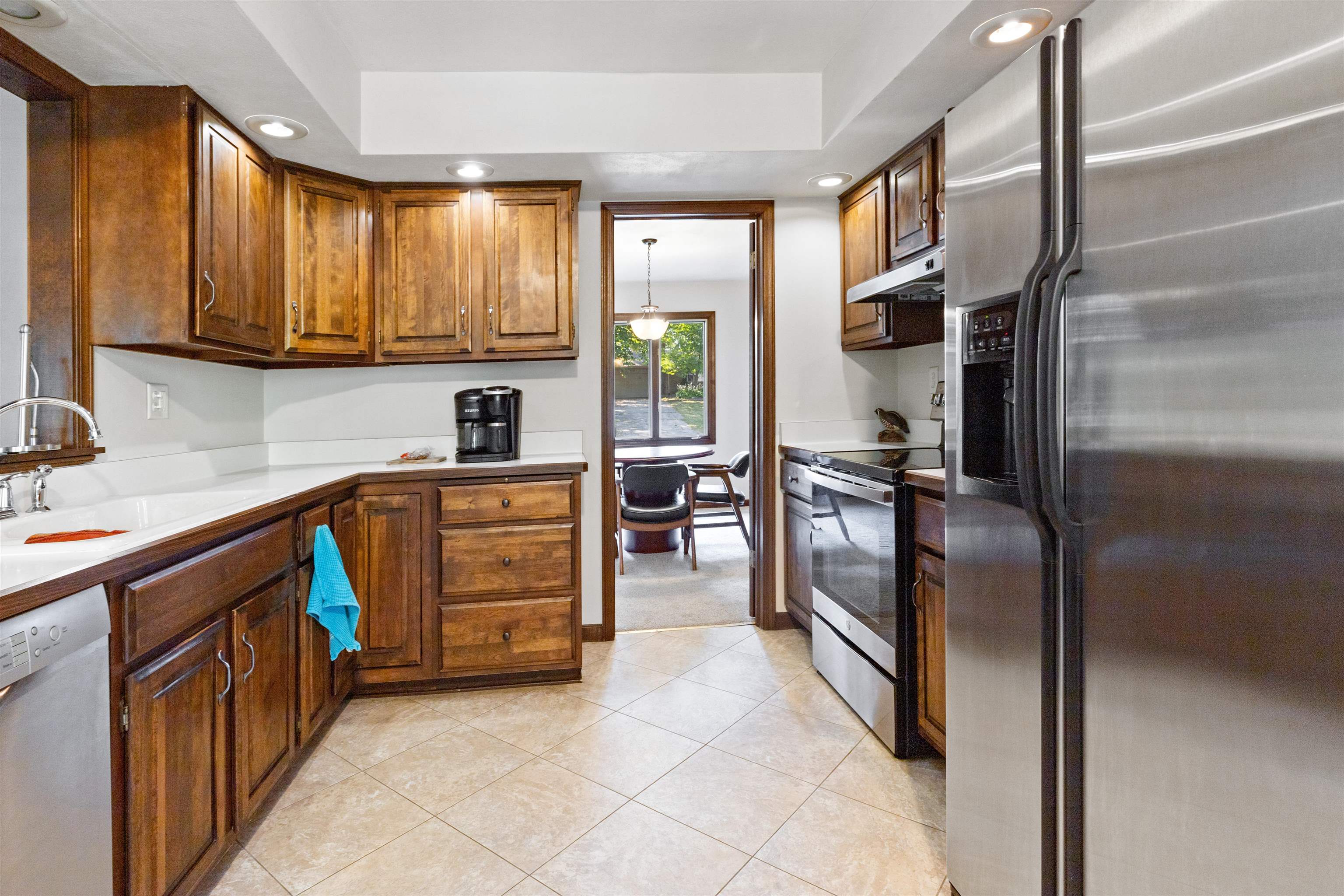 2518 Mandrake Drive Rockford, IL 61108 - Photo 7 of 50 a kitchen with stainless steel appliances granite countertop a refrigerator and a stove top oven