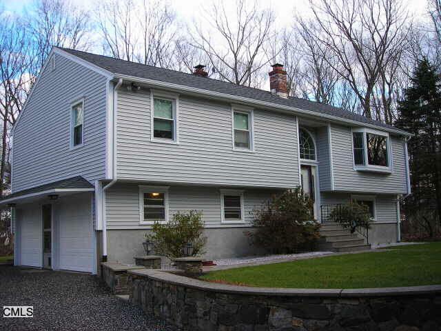 57 Rolling Ridge Road Shelton, CT 06484 - Photo 1 of 1 a front view of a house with garden