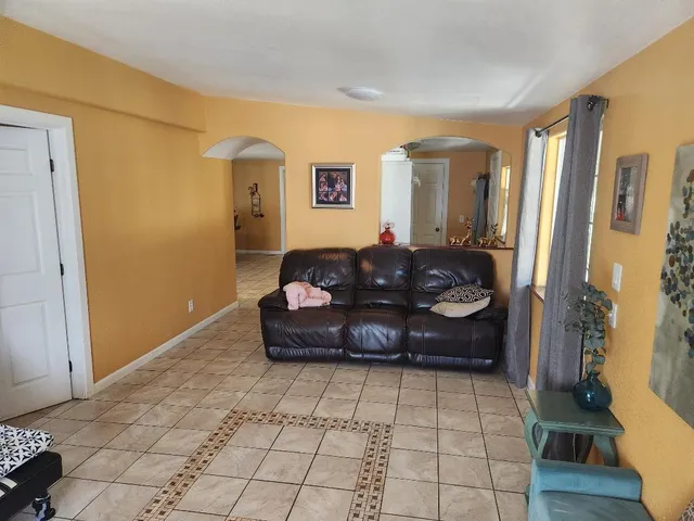 a living room with a couch and a table