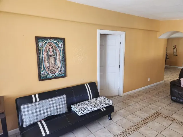 a view of room with furniture and couch