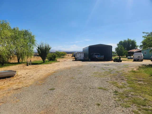 a view of street with parked cars