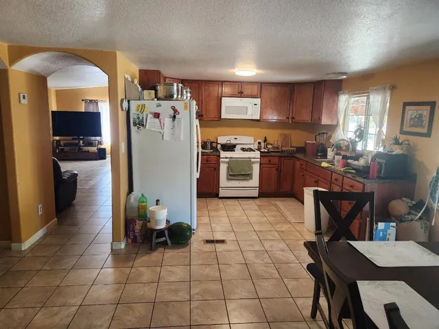 a kitchen with a cabinets and appliances