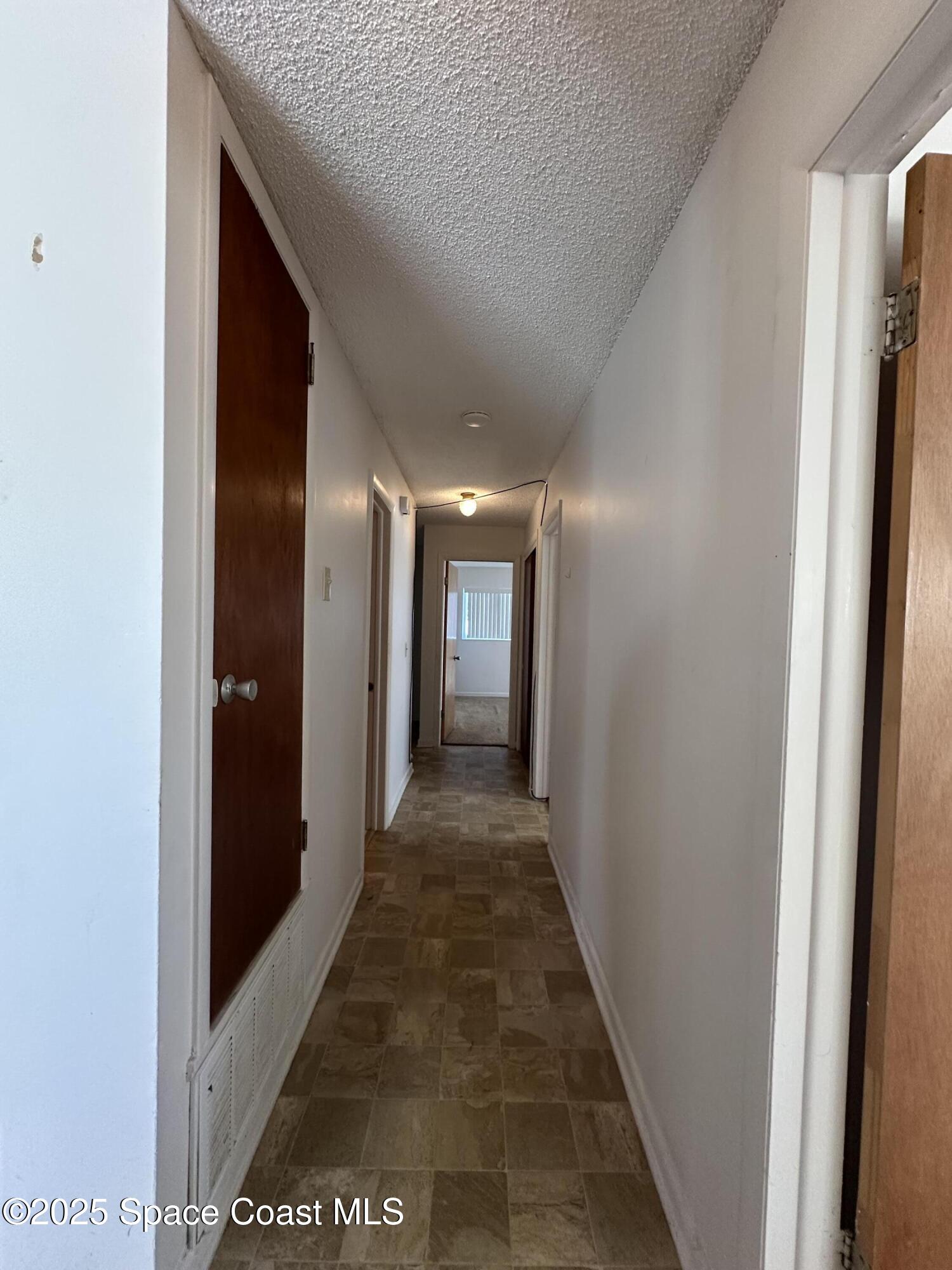 905 Grant Road Titusville, FL 32780 - Photo 17 of 30 a view of hallway with stairs