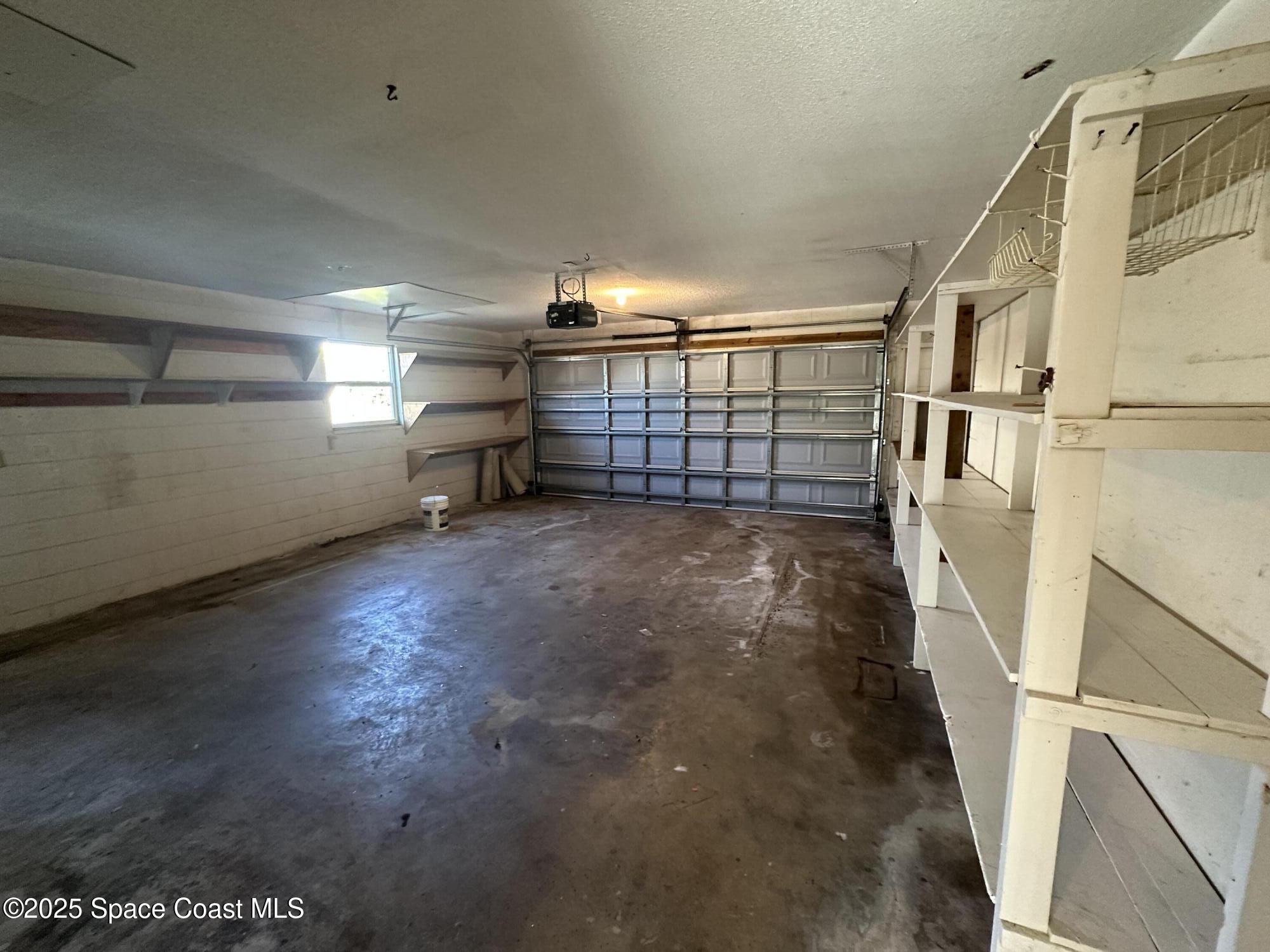 905 Grant Road Titusville, FL 32780 - Photo 25 of 30 a view of an empty room with stairs