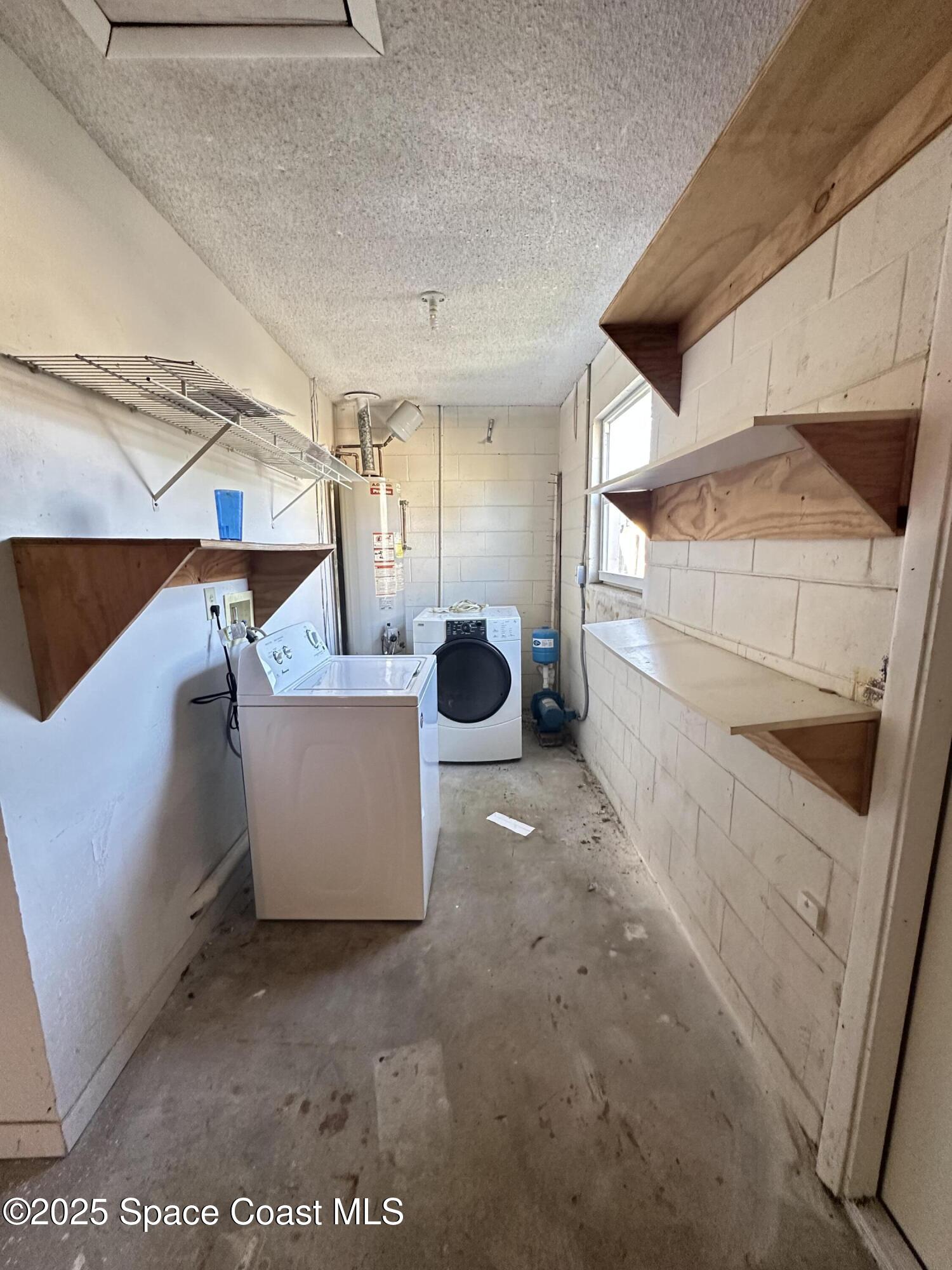905 Grant Road Titusville, FL 32780 - Photo 26 of 30 a view of a living room washer and dryer