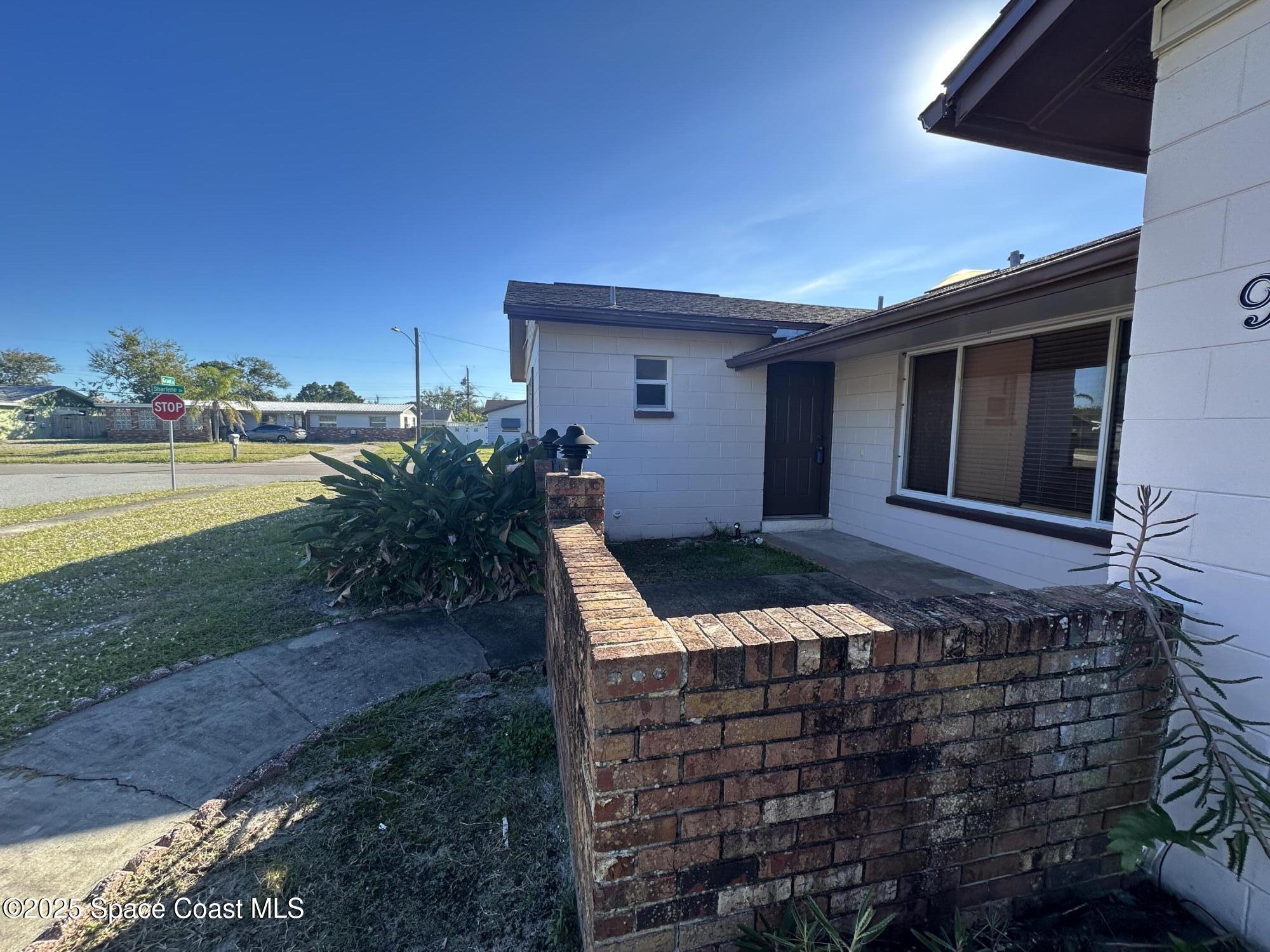 905 Grant Road Titusville, FL 32780 - Photo 3 of 30 a front view of a house with ocean view