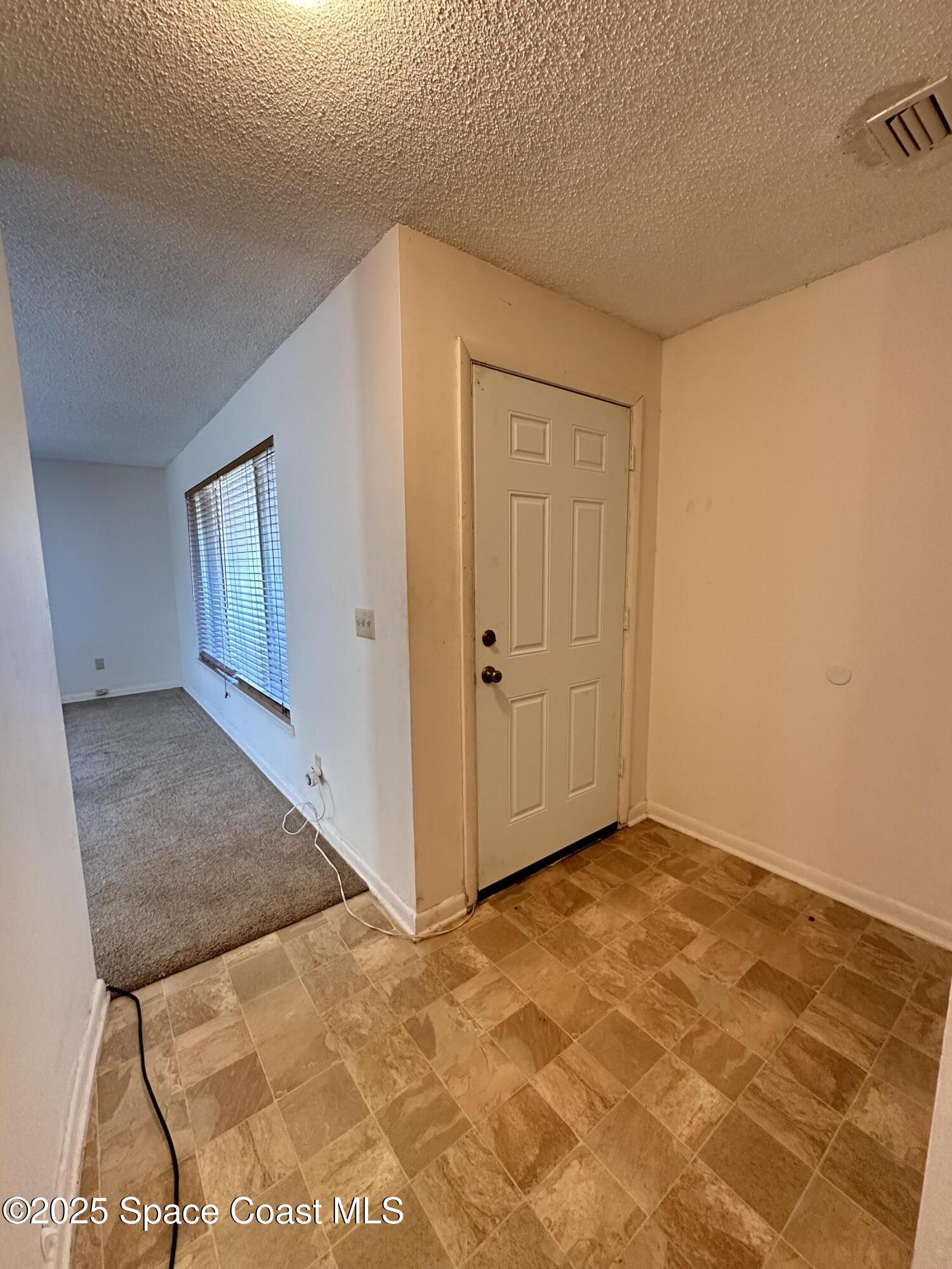 905 Grant Road Titusville, FL 32780 - Photo 4 of 30 a view of an empty room