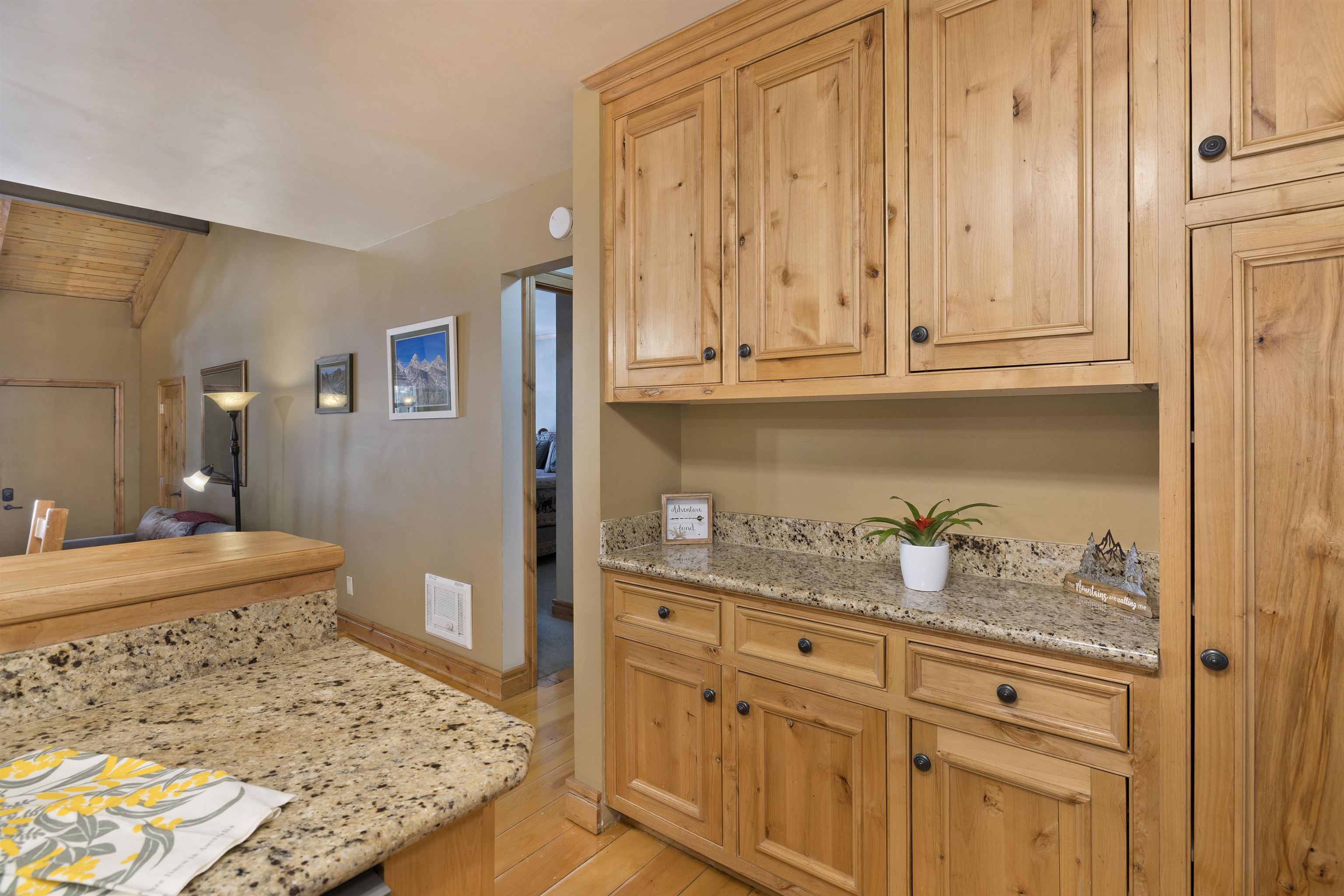 2252 Meridian Boulevard, Unit 32 Mammoth Lakes, CA 93546 - Photo 9 of 31 Kitchen with light stone counters, light wood finished floors, and lofted ceiling