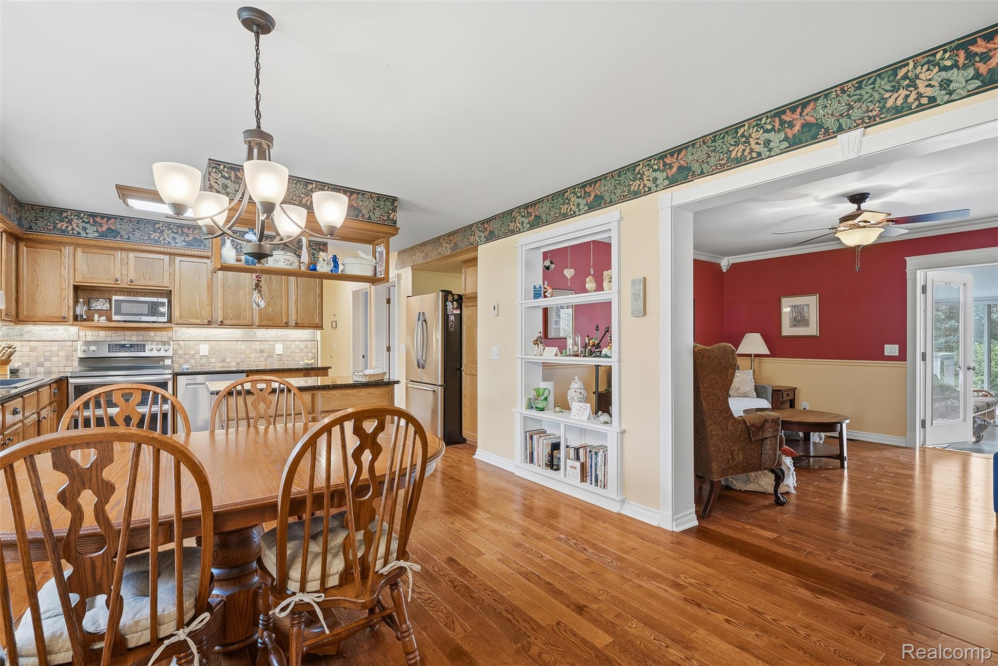 13182 Gilbert Road Memphis, MI 48041 - Photo 10 of 48 Hardwood flooring throughout the dining area and beyond