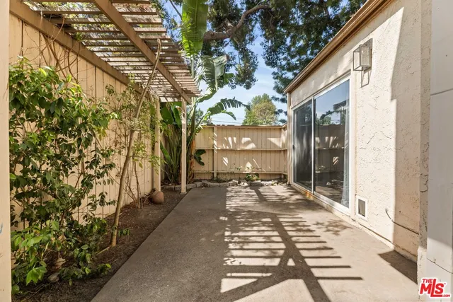 a view of a pathway both side of the house