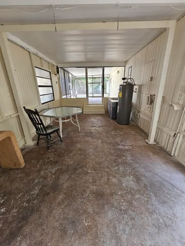 a front view of house with yard and outdoor seating
