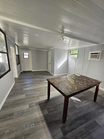 a view of a hallway with furniture