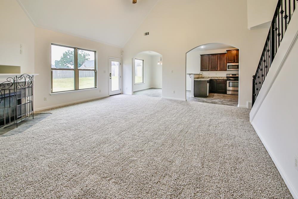 6839 Hare Pointe Bartlett, TN 38002 - Photo 14 of 35 an empty room with furniture and a fireplace