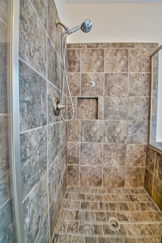 6839 Hare Pointe Bartlett, TN 38002 - Photo 18 of 35 a bathroom with a shower