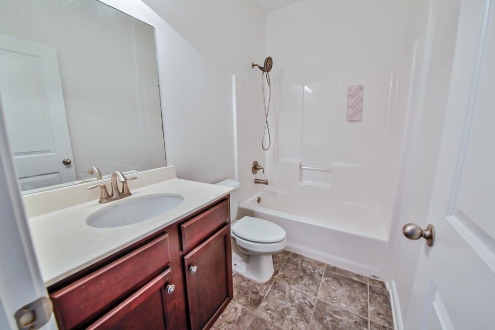 6839 Hare Pointe Bartlett, TN 38002 - Photo 23 of 35 a bathroom with a sink a toilet and shower