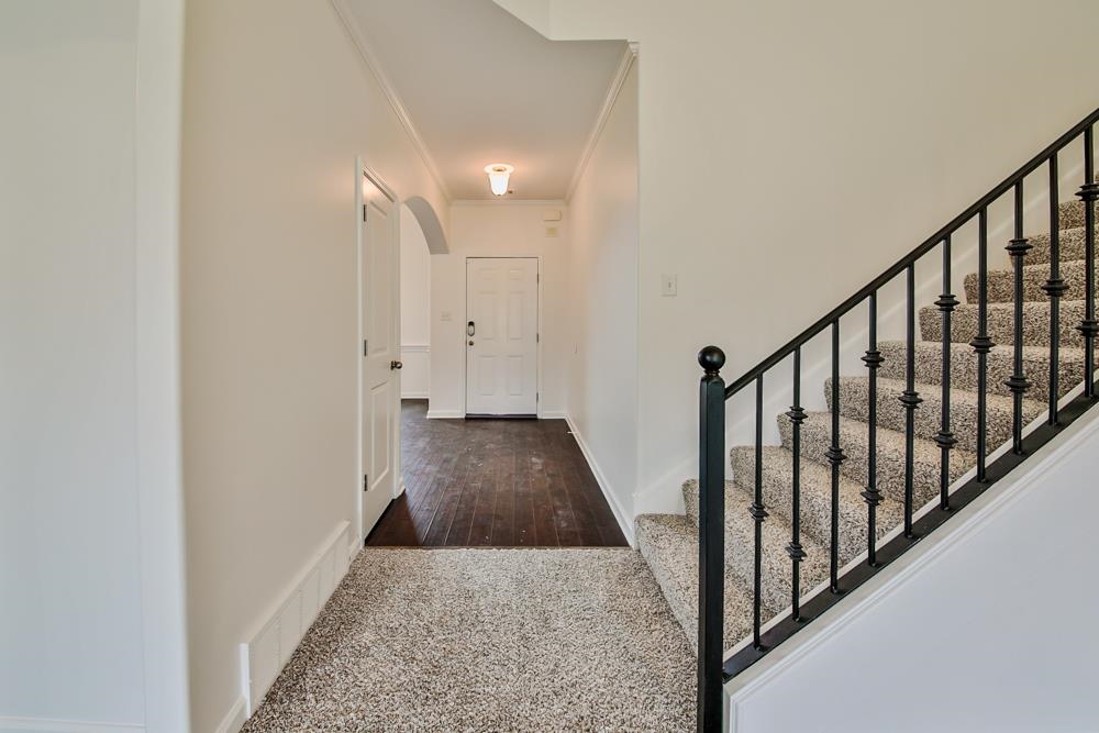 6839 Hare Pointe Bartlett, TN 38002 - Photo 32 of 35 a view of a hallway with wooden floor and staircase