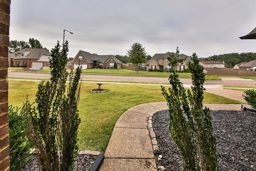 6839 Hare Pointe Bartlett, TN 38002 - Photo 7 of 35 a view of a lake with a yard