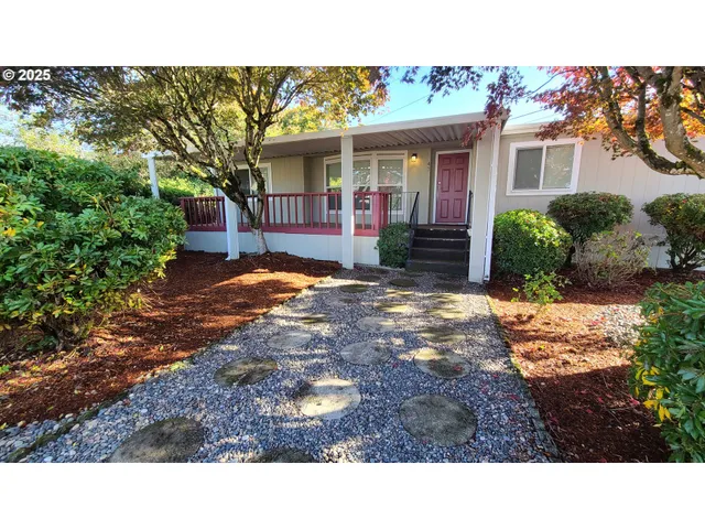 a view of house with yard