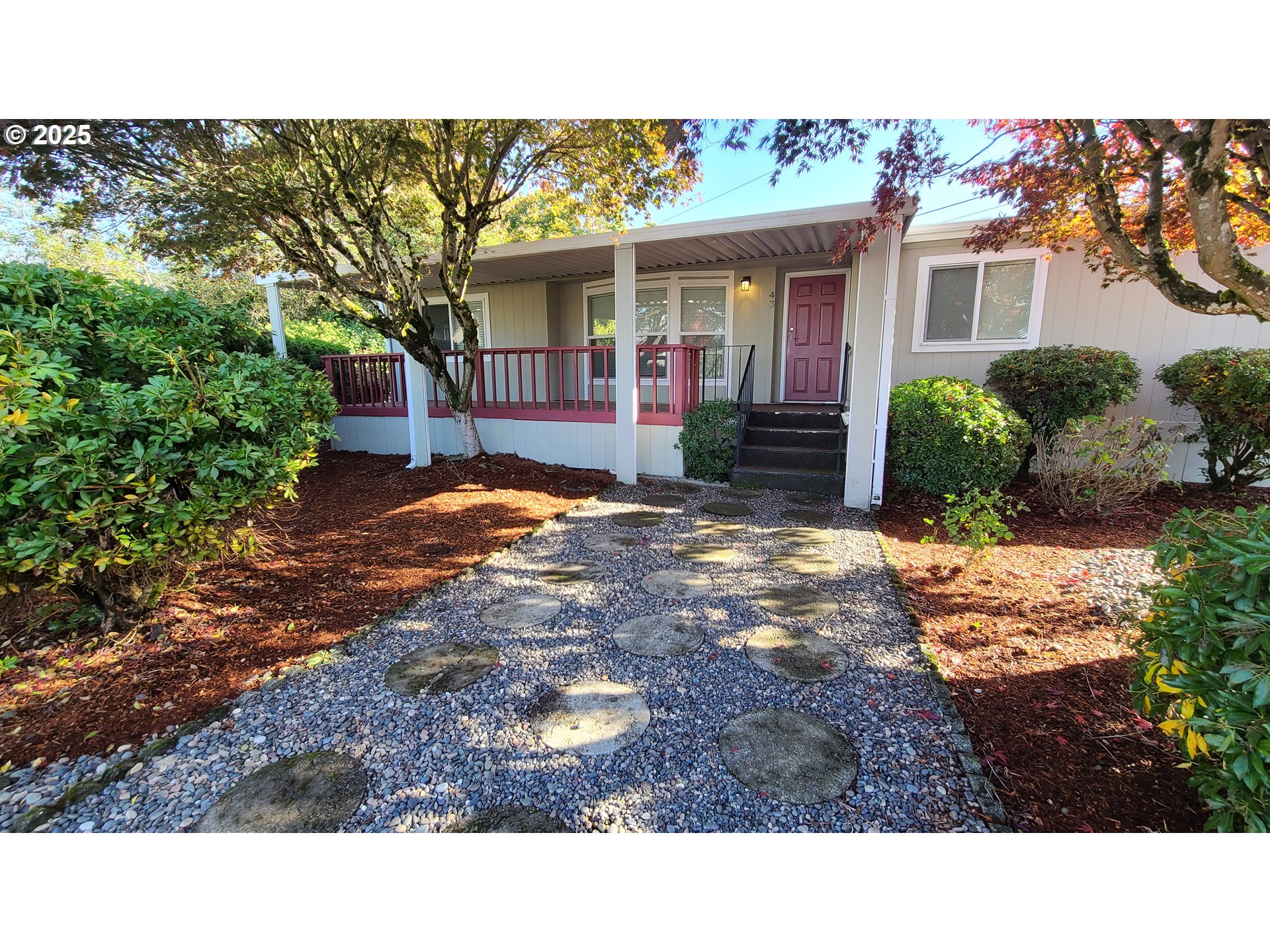 a view of house with yard