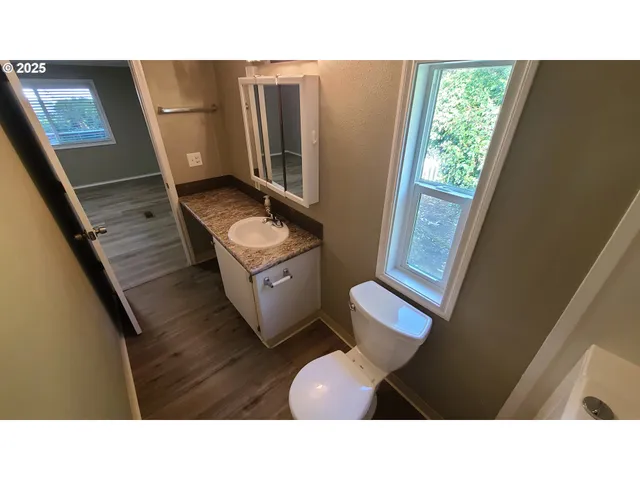 a black and white photo of a living room