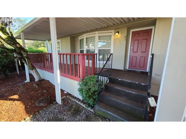 a black and white photo of a house