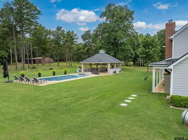 a view of swimming pool with a garden