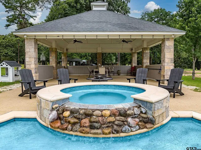 an aerial view of a house with a swimming pool