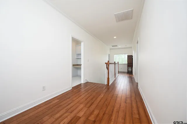 an empty room with a kitchen
