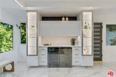 a view of a bench and trees in the background