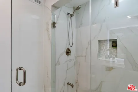 a view of sitting area with furniture and wooden floor