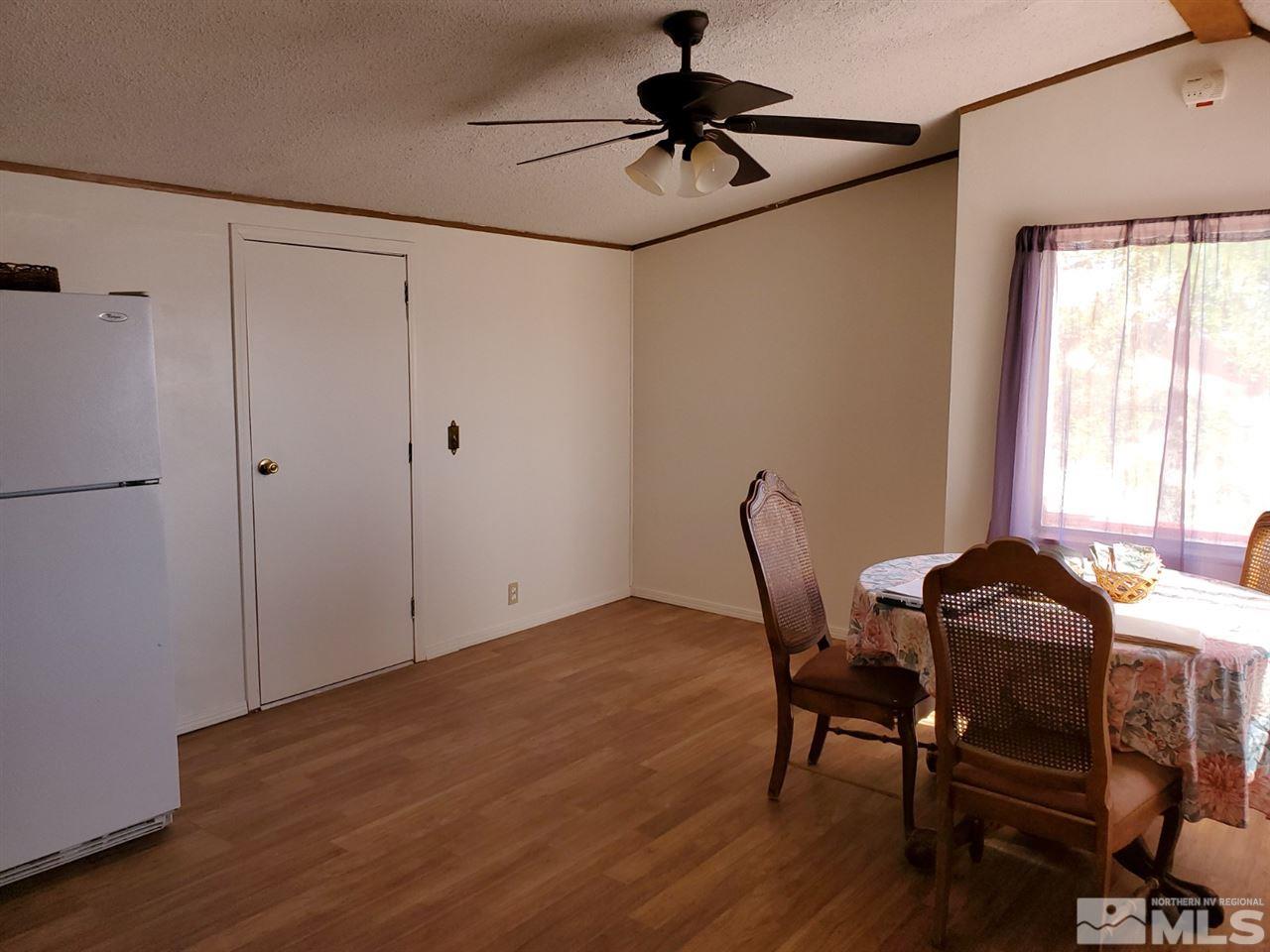 132 Lucille Drive Walker Lake, NV 89415 - Photo 19 of 36 a dining room with furniture and window