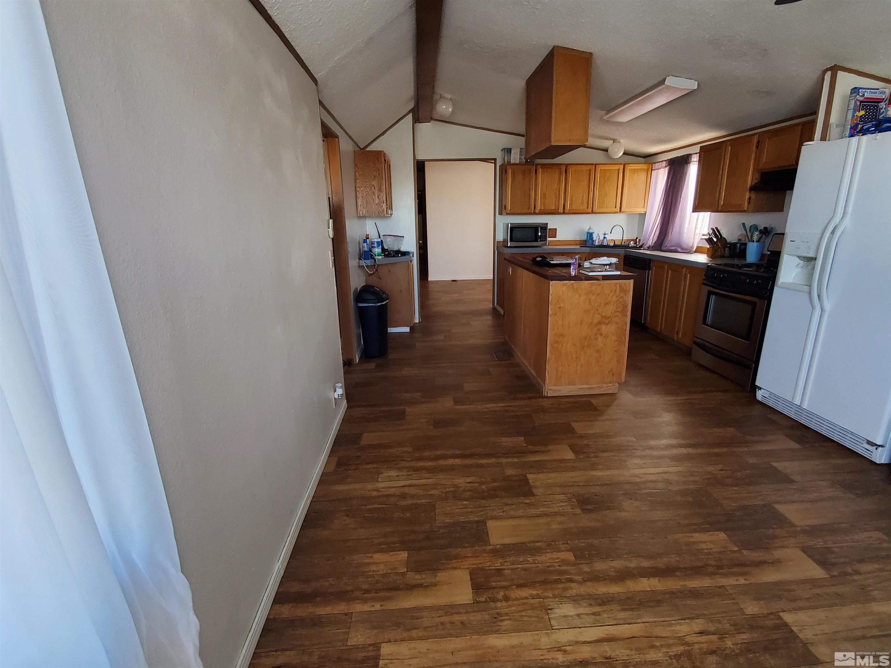 132 Lucille Drive Walker Lake, NV 89415 - Photo 20 of 36 a kitchen with stainless steel appliances granite countertop a refrigerator a stove and a sink