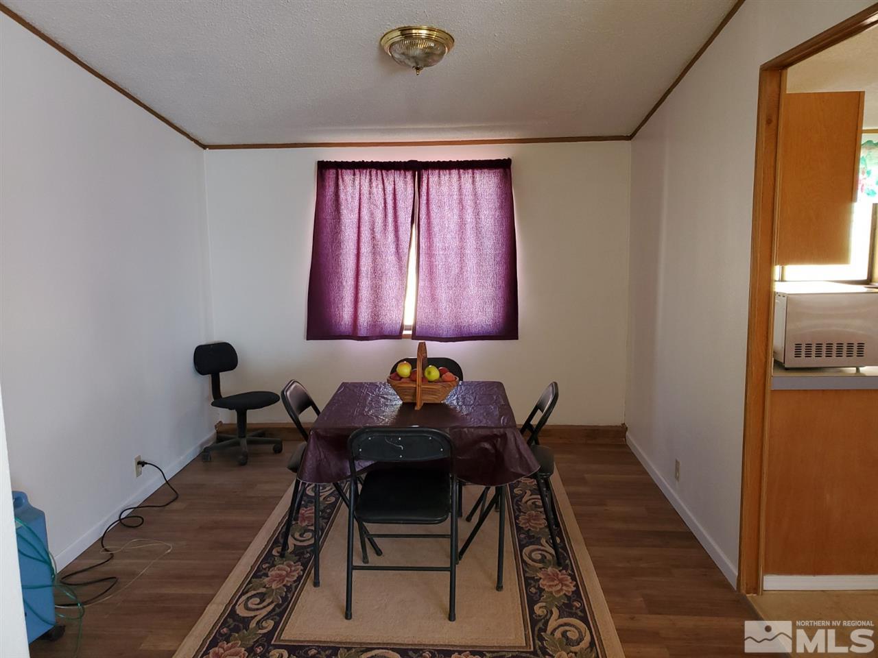 132 Lucille Drive Walker Lake, NV 89415 - Photo 23 of 36 a table and chairs in a room