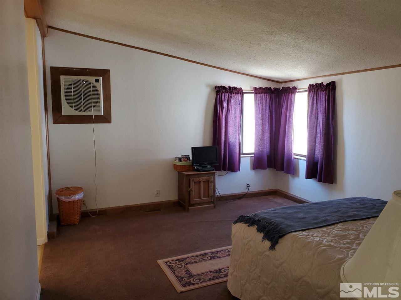 132 Lucille Drive Walker Lake, NV 89415 - Photo 30 of 36 a living room with furniture and a window