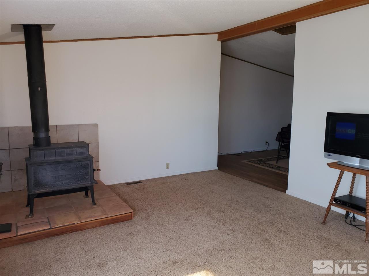 132 Lucille Drive Walker Lake, NV 89415 - Photo 8 of 36 a living room with furniture and a flat screen tv