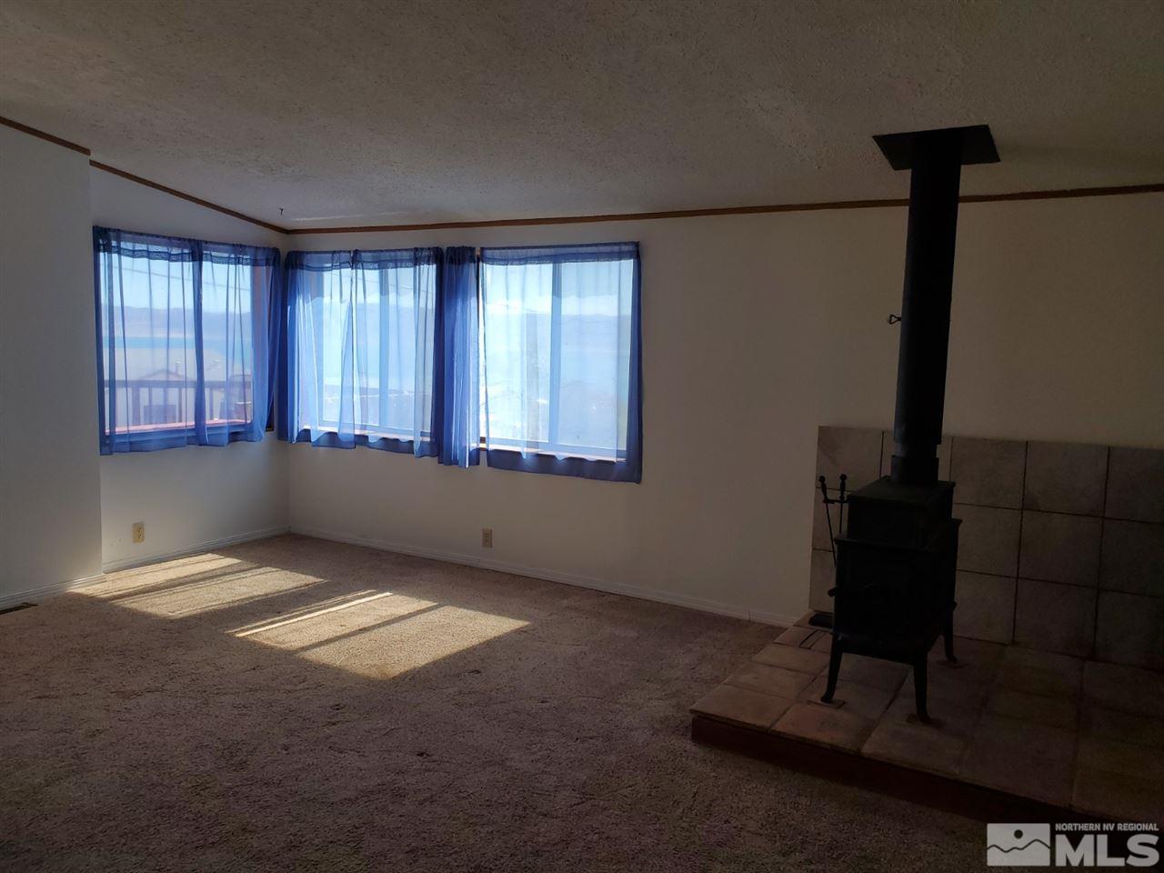 132 Lucille Drive Walker Lake, NV 89415 - Photo 10 of 36 a view of an empty room with a window