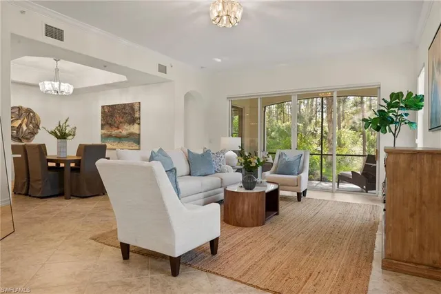 a spacious bedroom with a bed and a couch