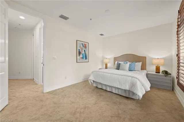 a bathroom with a double vanity sink toilet and a mirror